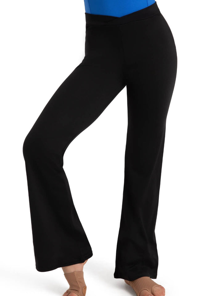 Black pants worn by a person on a white background