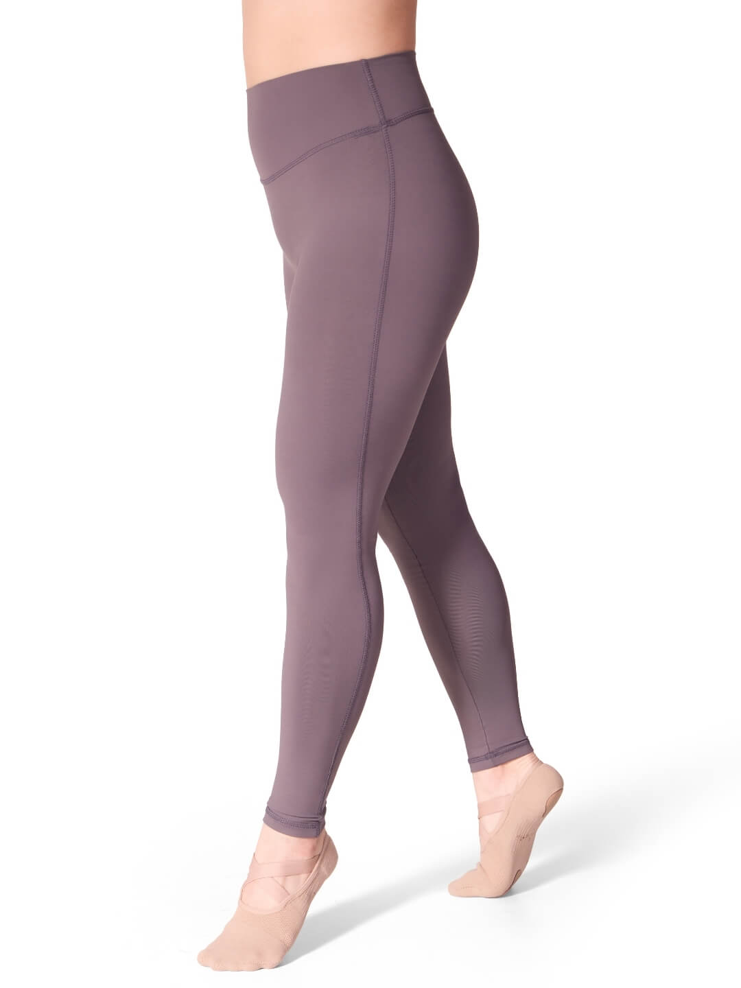 Purple leggings worn by a person on a white background
