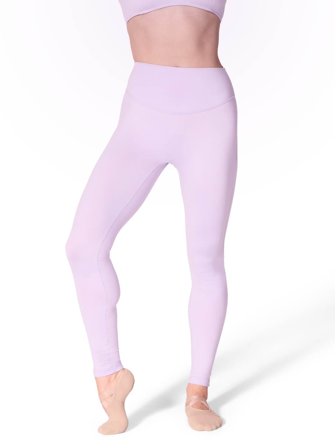 Person wearing lavender leggings on a white background