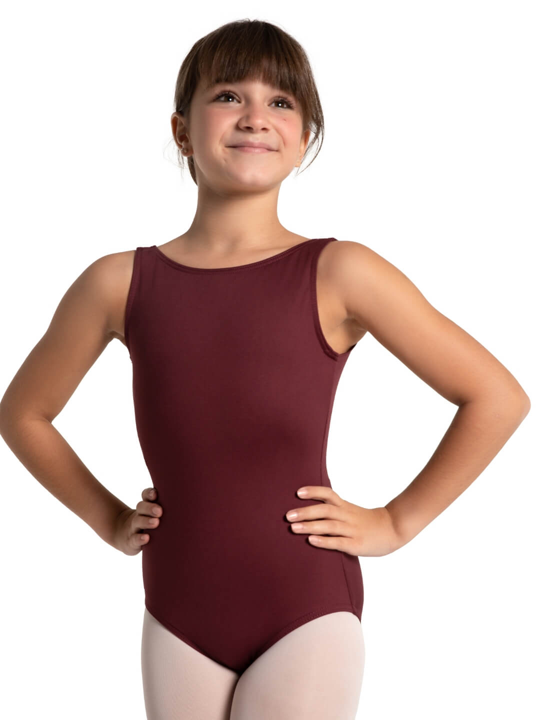 Young girl wearing a maroon leotard on a white background