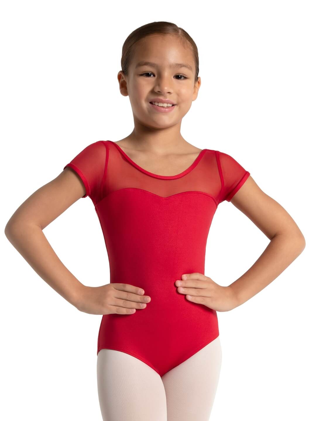 Young girl wearing a red leotard on a white background