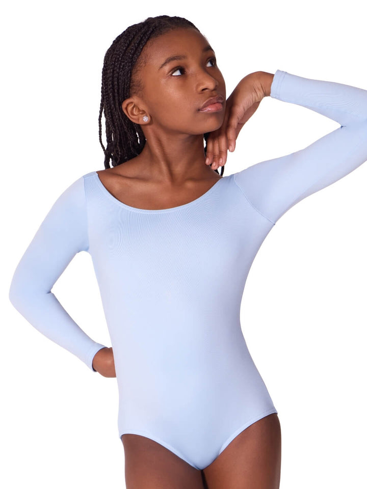 Woman wearing a light blue long-sleeve bodysuit on a white background