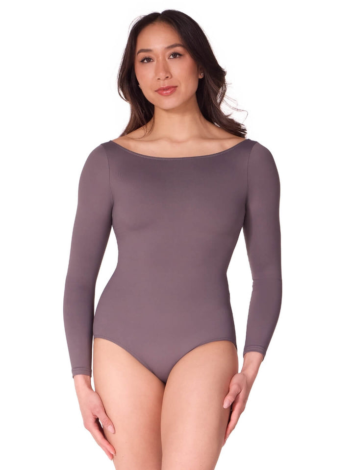 Woman wearing a long-sleeve bodysuit on a white background