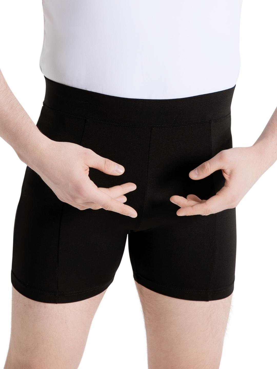 Person wearing black shorts on a white background