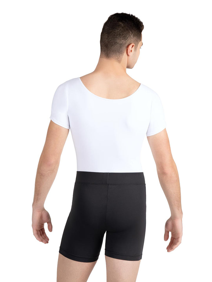 Person wearing a white t-shirt and black shorts on a white background