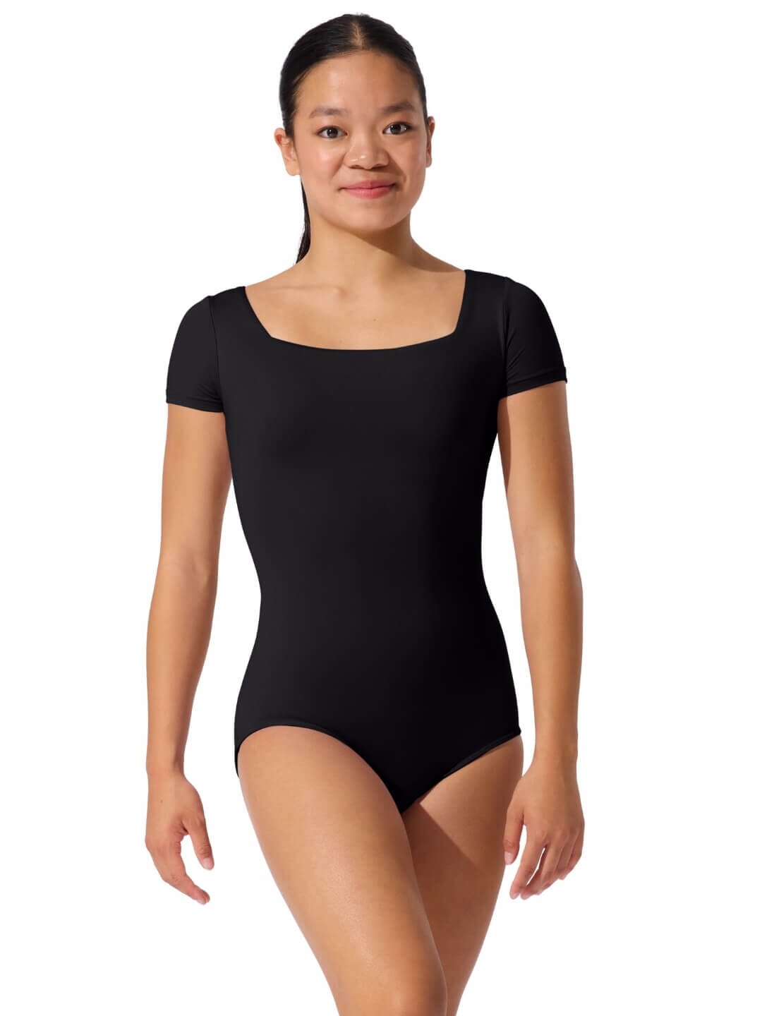 Woman wearing a black leotard on a white background