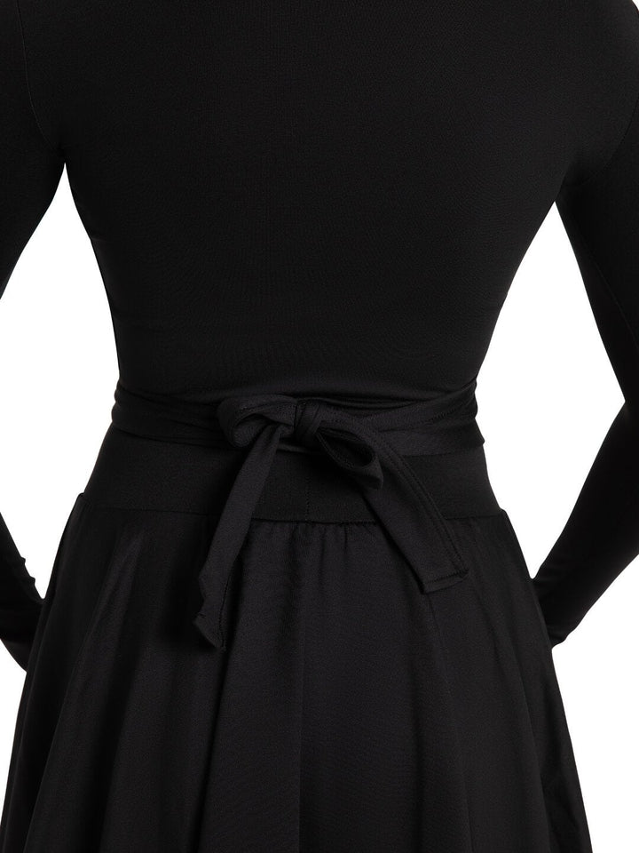 Black dress with a tie waist on a white background