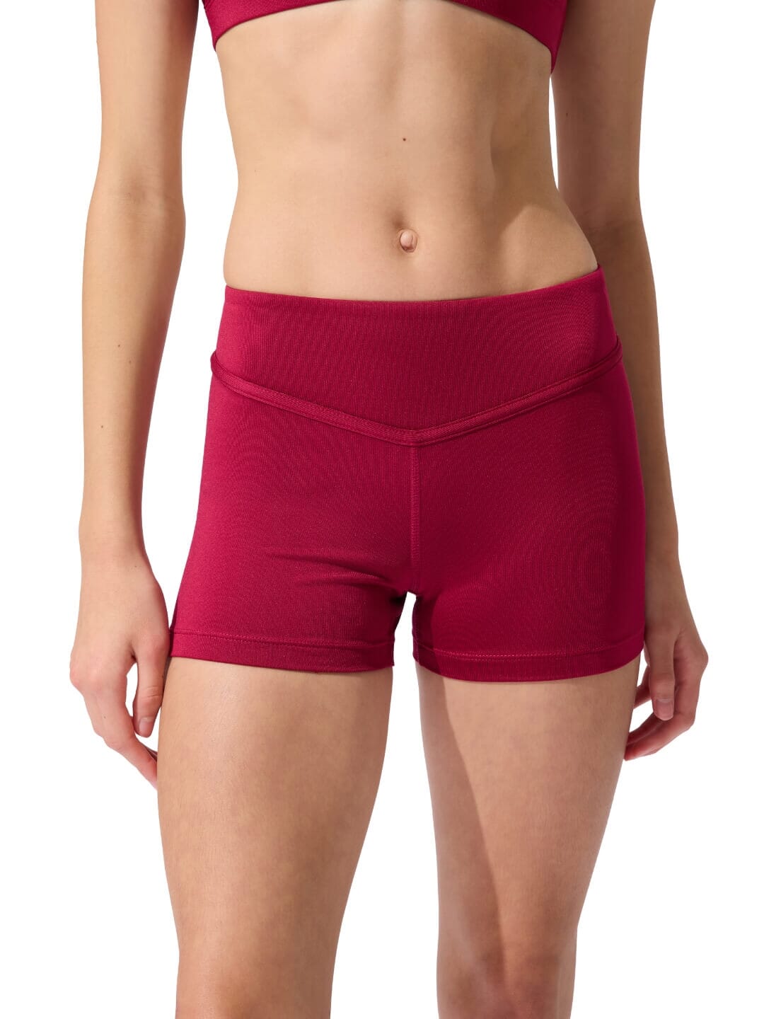 Red athletic shorts worn by a person on a white background