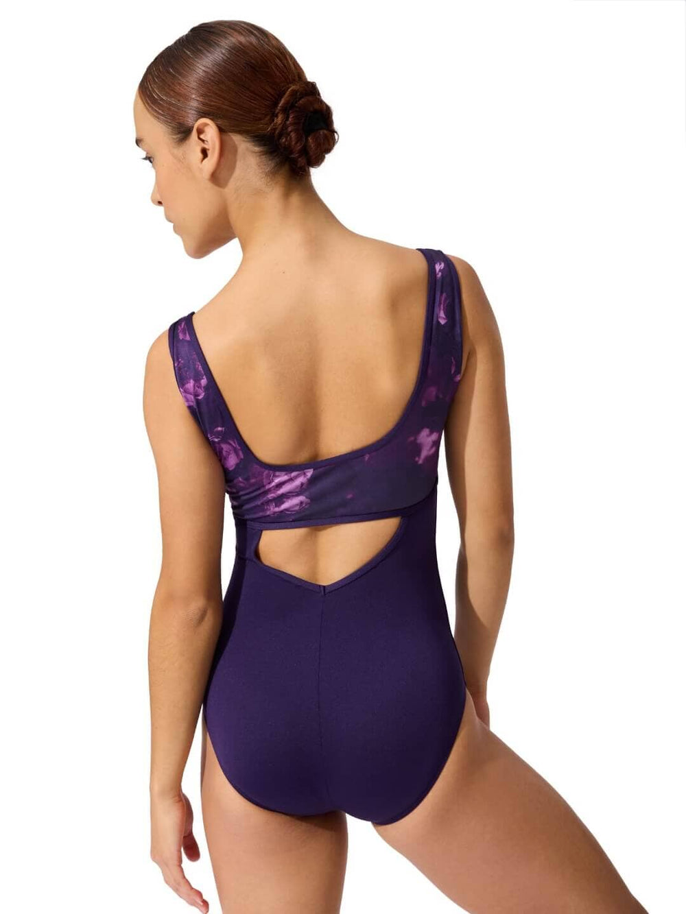 Purple swimsuit with cut-out design on a white background