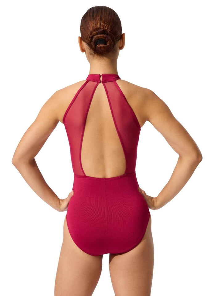 Red swimsuit with open back worn by a model on a white background