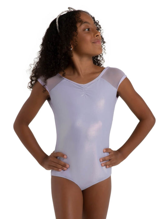 Young girl wearing a Lav leotard with sheer sleeves on a white background