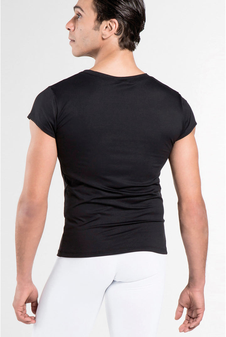 Person wearing a black t-shirt and white pants on a plain background