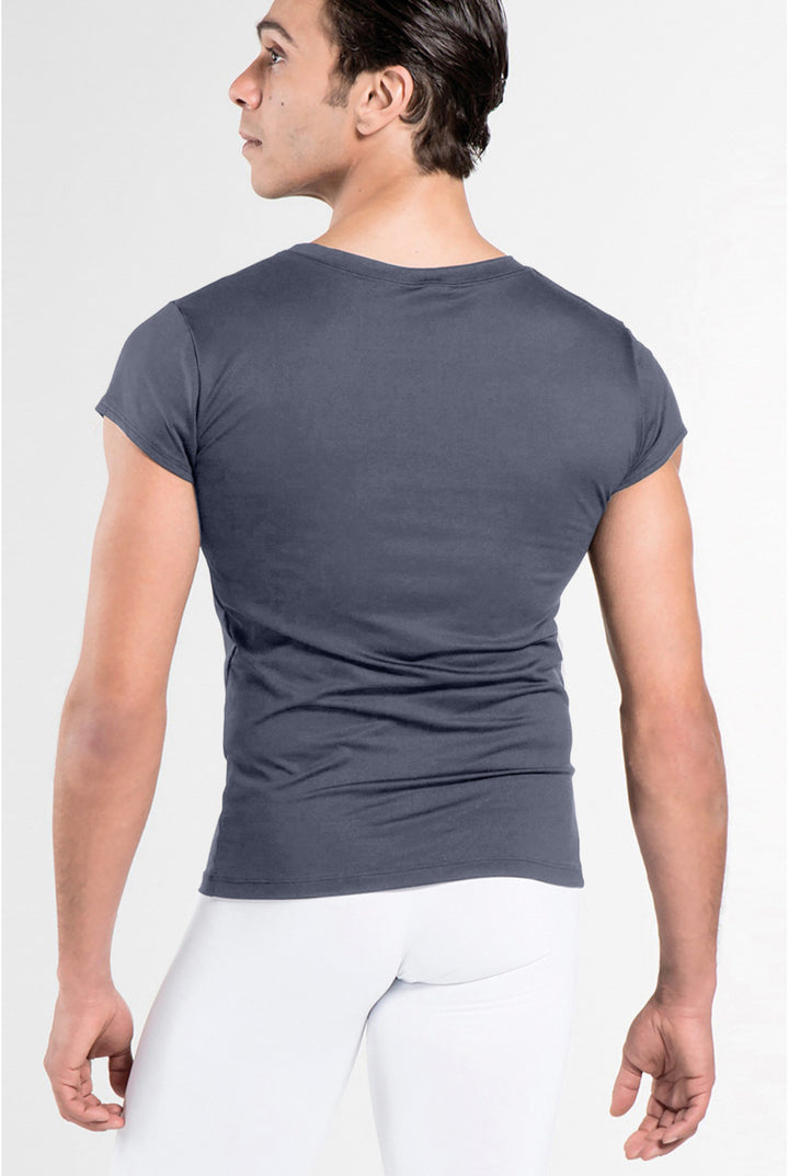 A man wearing a dark gray short-sleeve crewneck t-shirt, shown from the back against a light gray studio background.