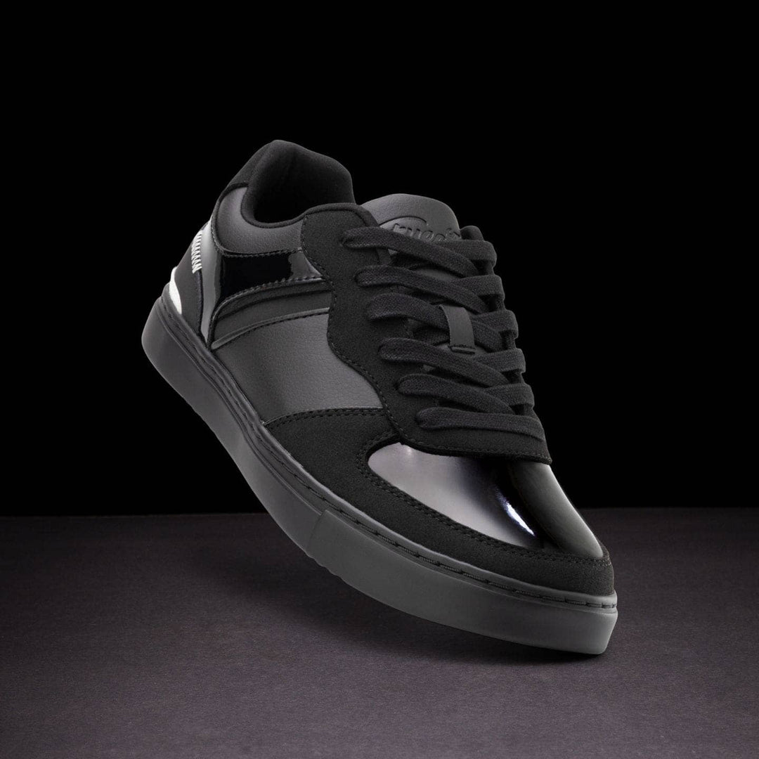 Black and gray sneaker on a dark background