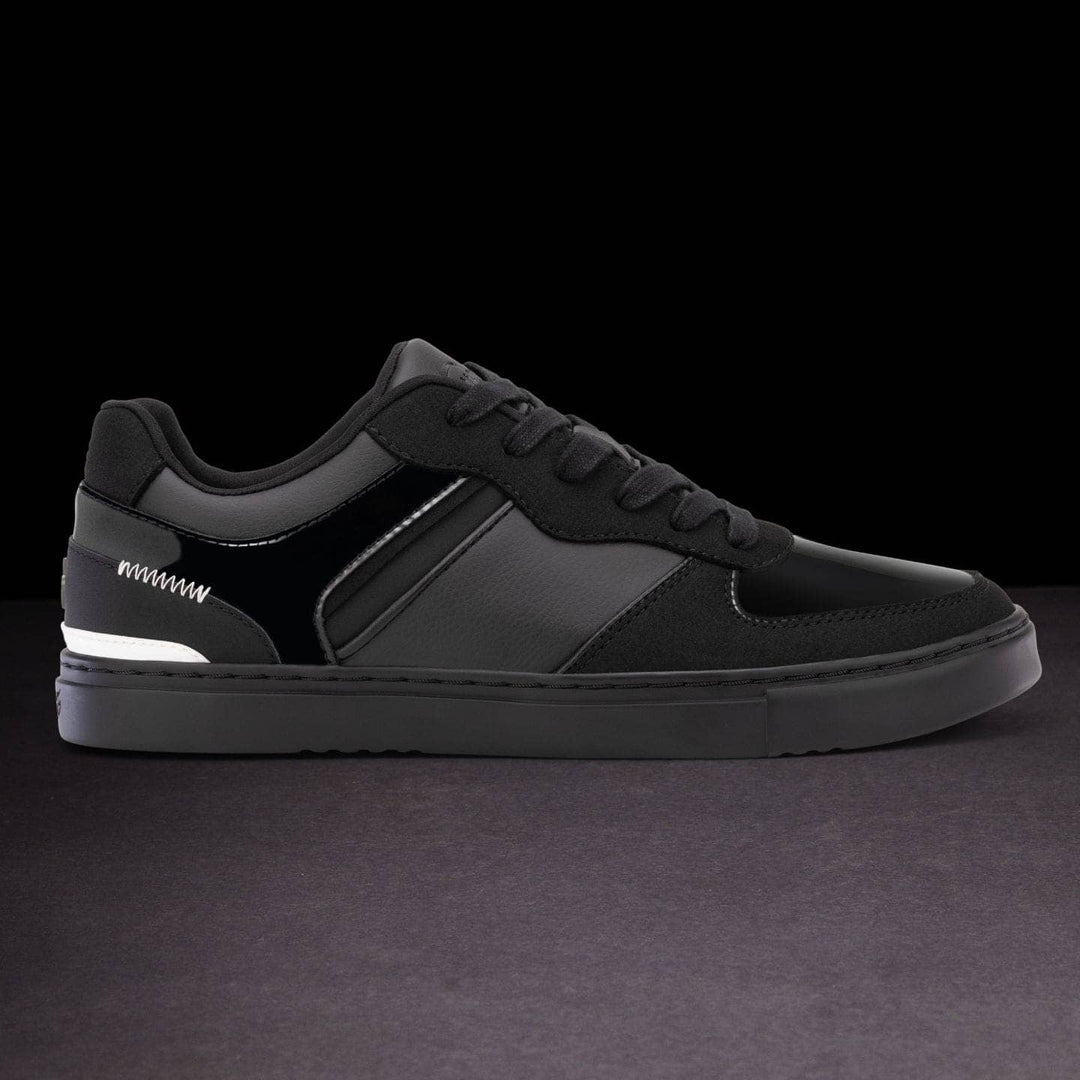 Black sneaker on a dark background