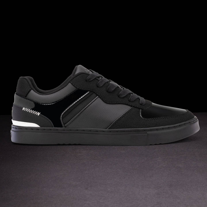 Black sneaker on a dark background
