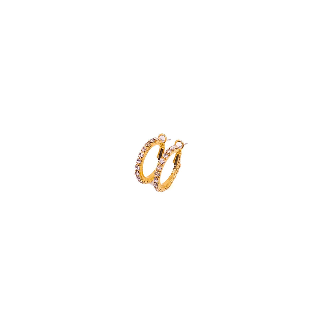 Gold hoop earrings with small stones on a white background