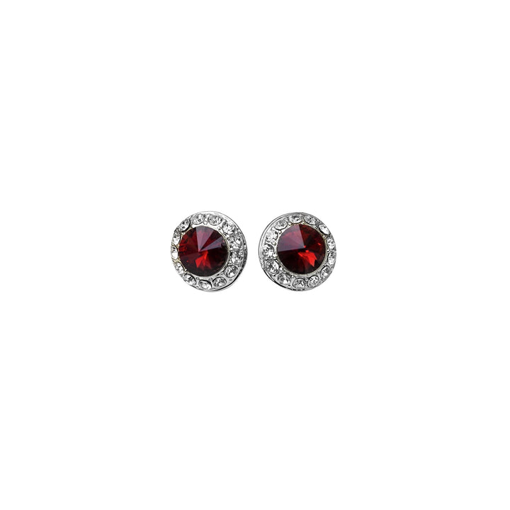 Pair of earrings with red gemstones on a white background