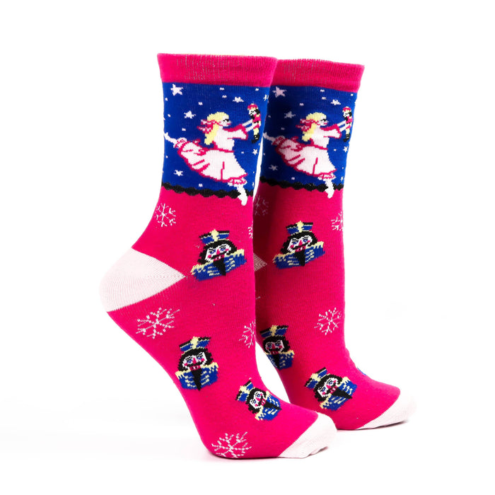 Pink socks with cartoon character design on a white background