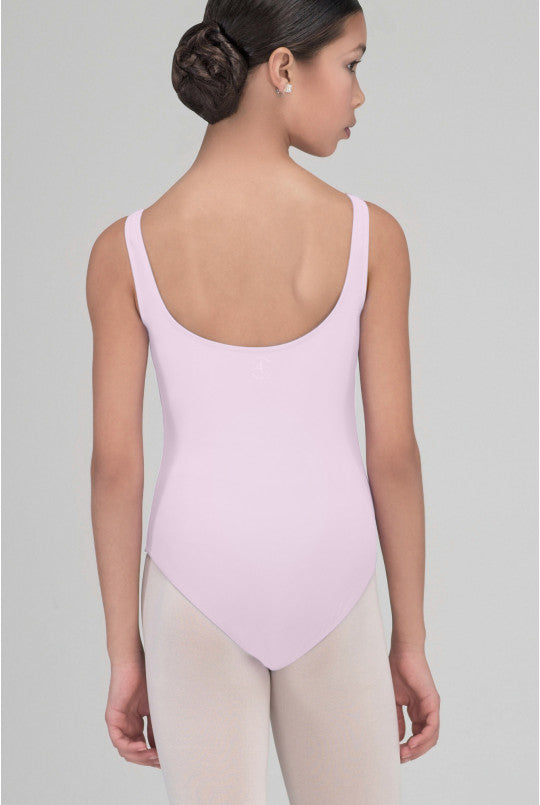 Person wearing a pink leotard on a plain background