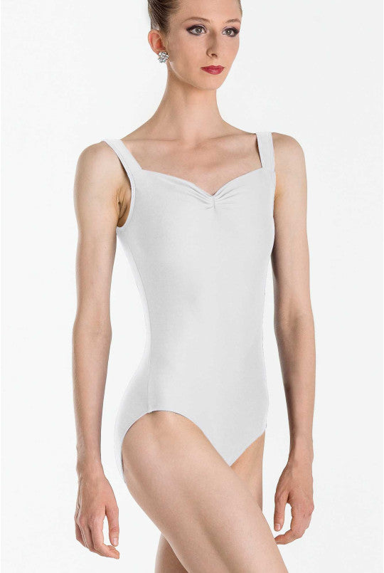 Woman wearing a white leotard on a white background