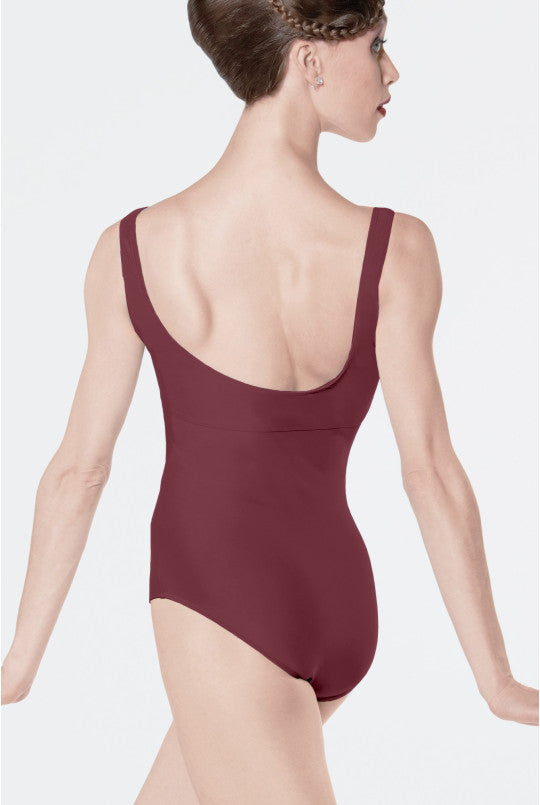 Burgundy leotard worn by a model on a plain background