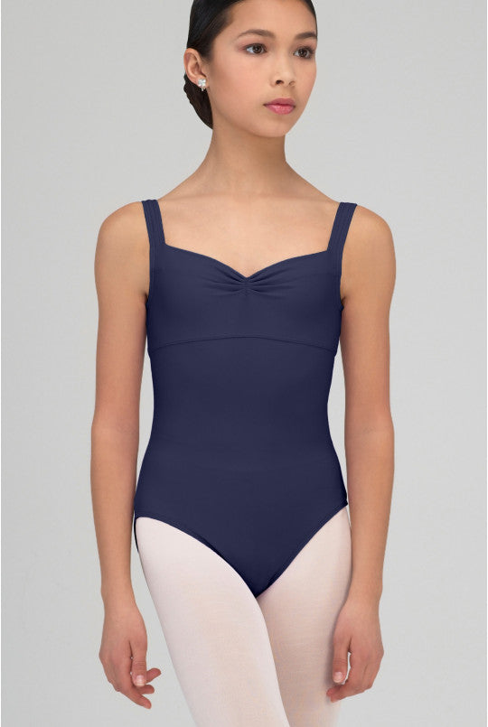 Person wearing a navy blue leotard on a plain background