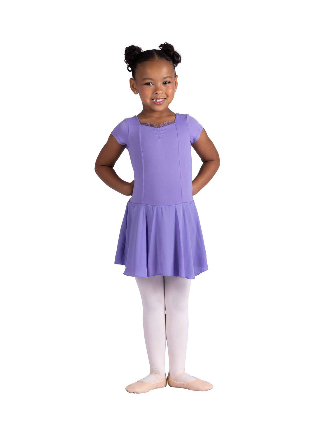 Young girl wearing a purple dress on a white background