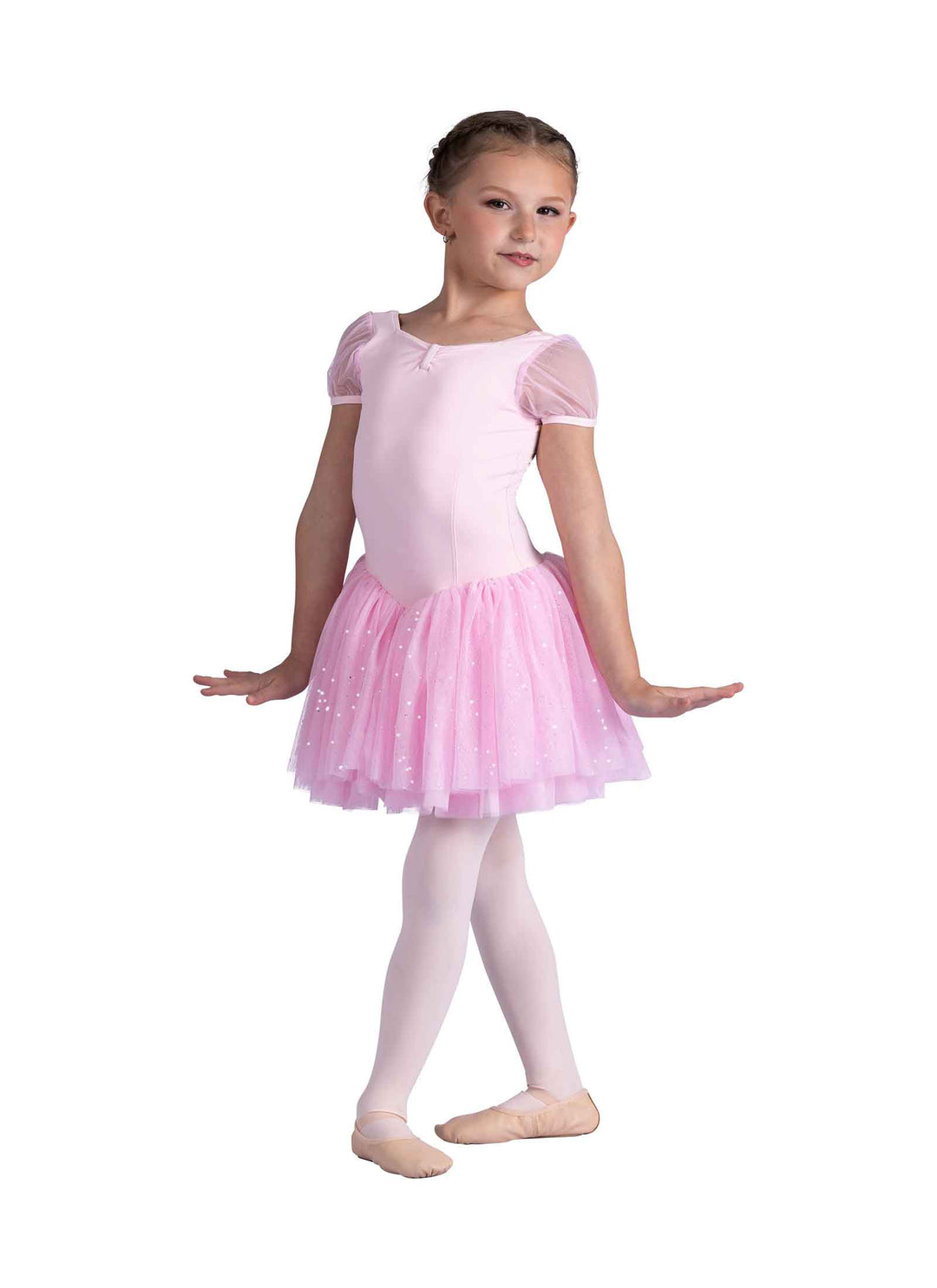 Young girl in a pink ballet dress on a white background