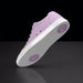 Purple sneaker with white sole on a black background