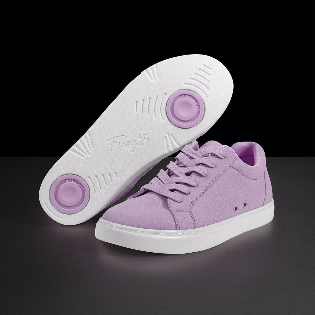 Purple sneakers with white soles on a black background