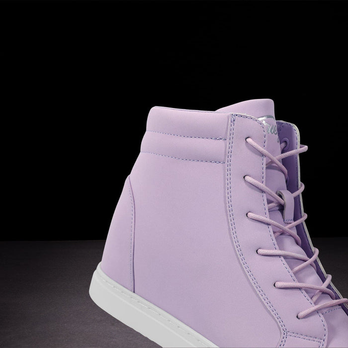 Purple high-top sneaker with white sole on a black background