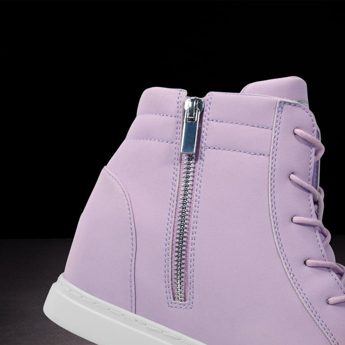 Purple high-top sneaker with a zipper on a black background