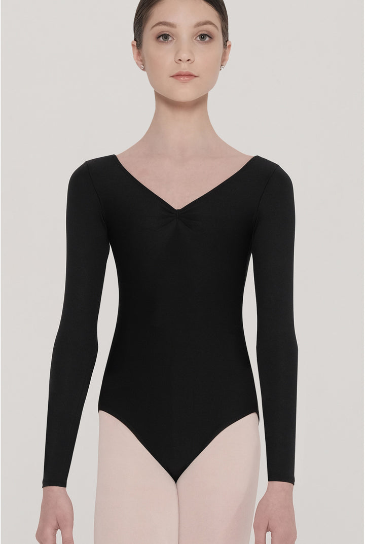 Person wearing a navy blue long-sleeve leotard on a plain background