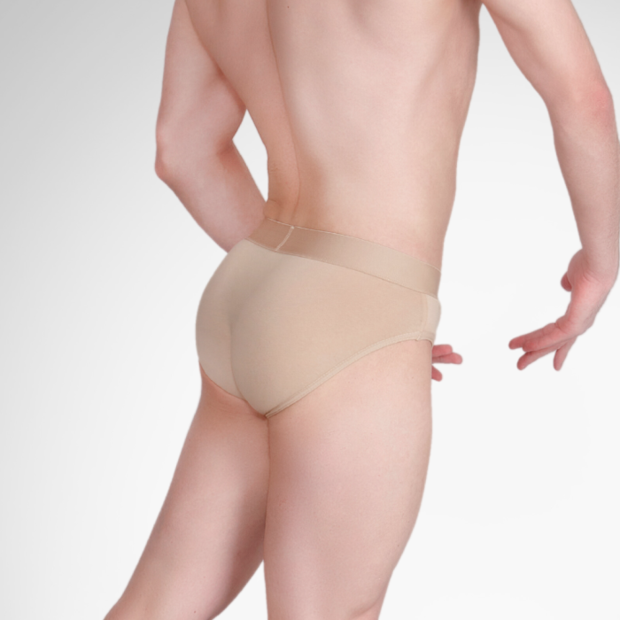 Beige underwear worn by a person on a plain background