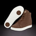 Brown high-top sneakers with white soles on a black background
