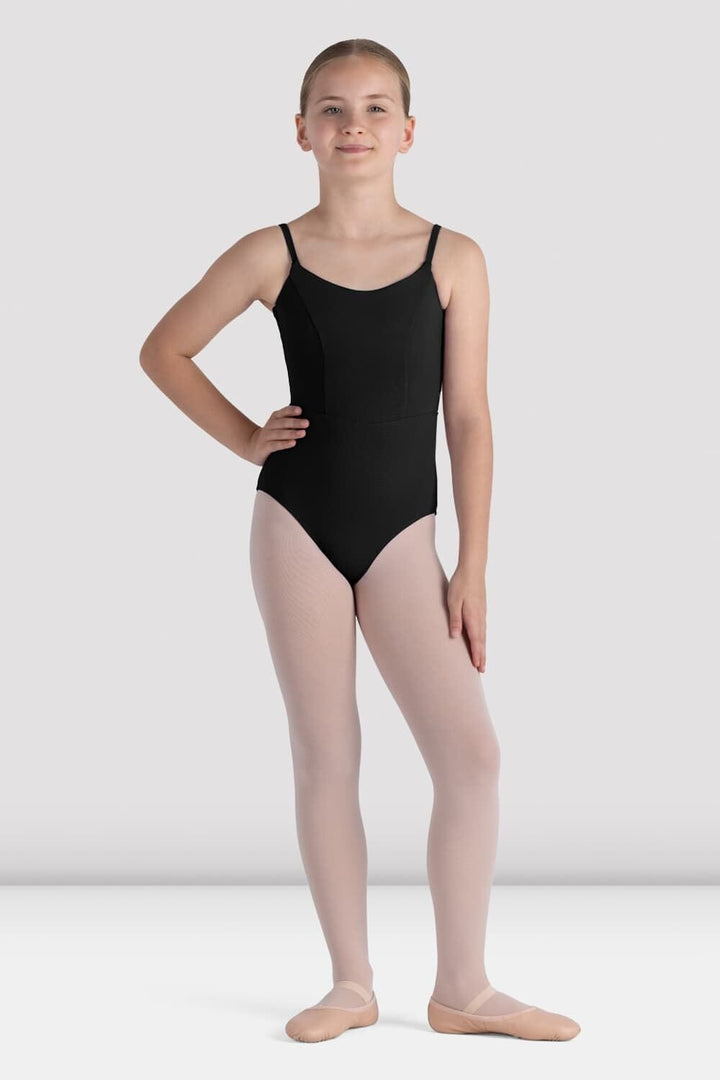 Person wearing a black leotard and beige tights on a white background
