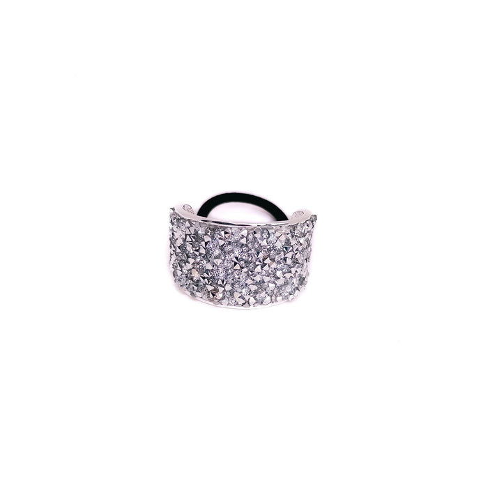Silver glittery hair tie on a white background