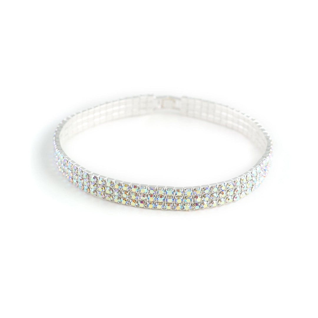 Silver bracelet with clear gemstones on a white background
