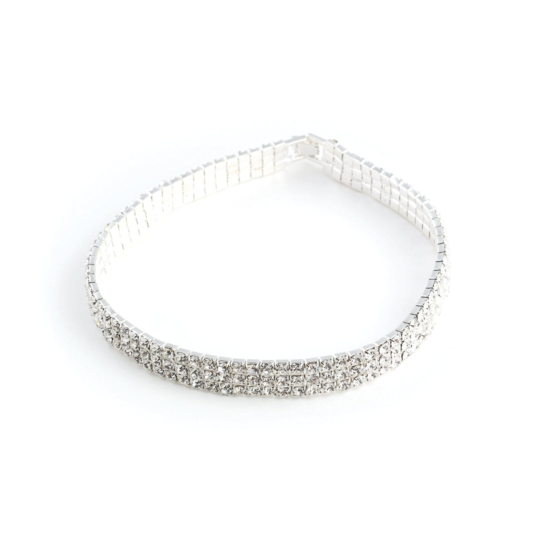 Silver headband with clear rhinestones on a white background