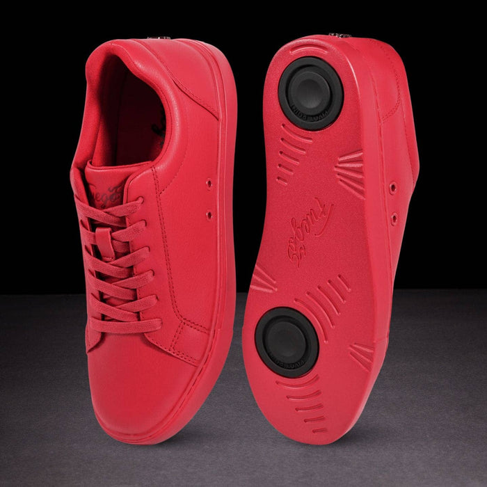 Red sneakers with black sole on a dark background