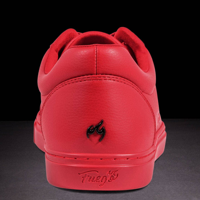 Red sneaker with a brand logo on a black background