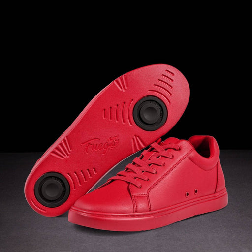 Red sneakers with a black sole on a dark background