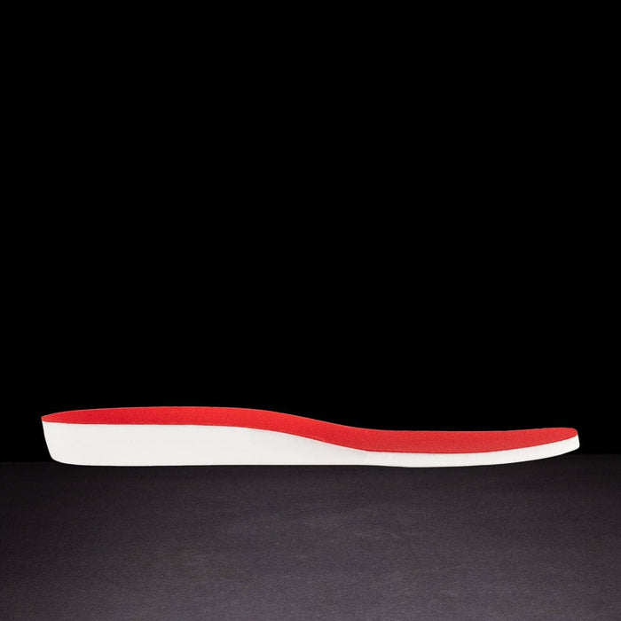 Red and white shoe insole on a black background