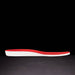 Red and white shoe insole on a black background