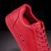 Red sneaker on a black background