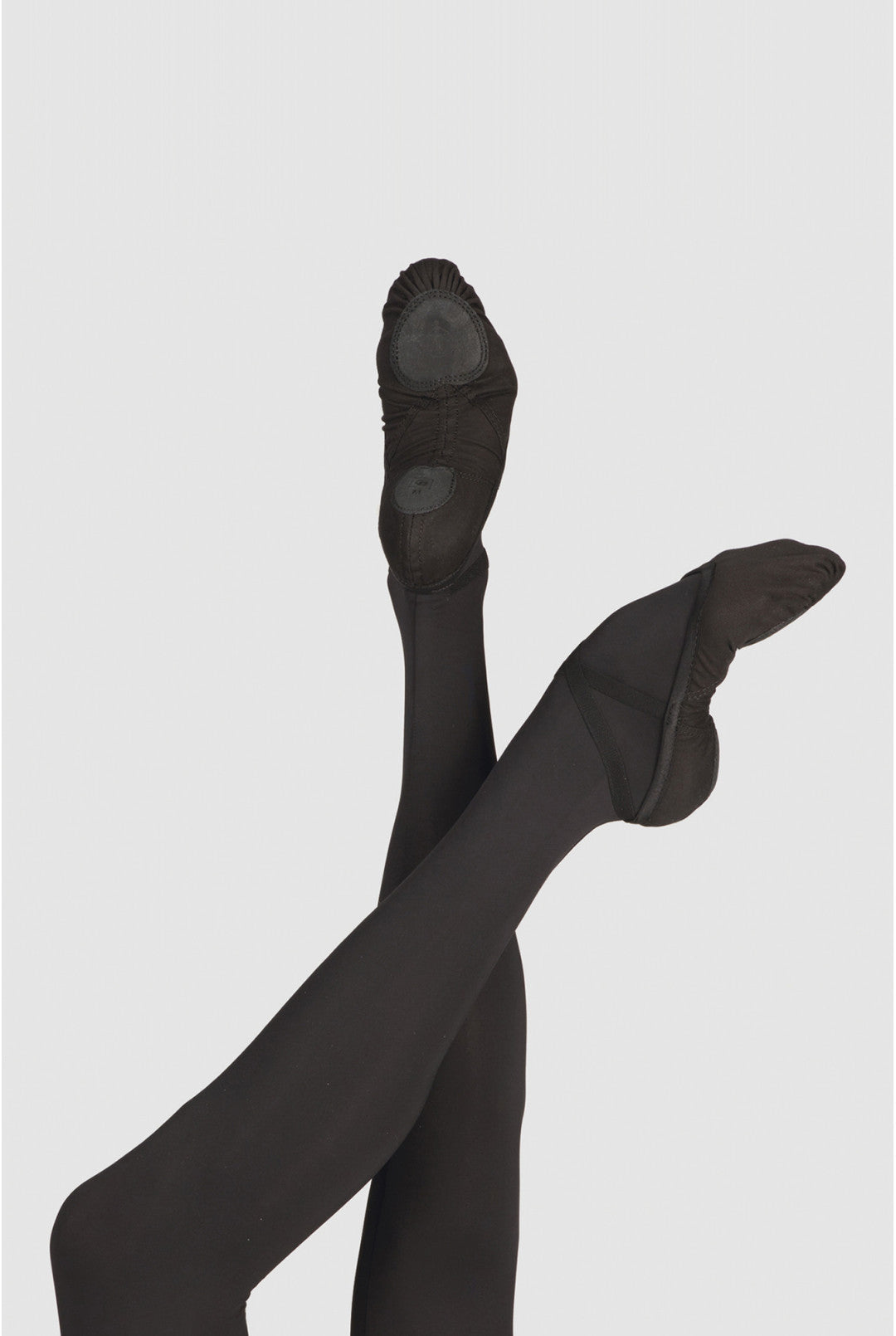 Black tights with black shoes on a light gray background