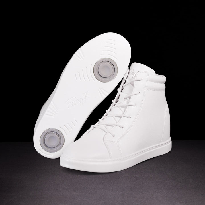 A pair of white, high-top wedge sneakers with lace-up closure, showcasing the side profile of the shoes with the sole visible, displaying the wedge heel design.